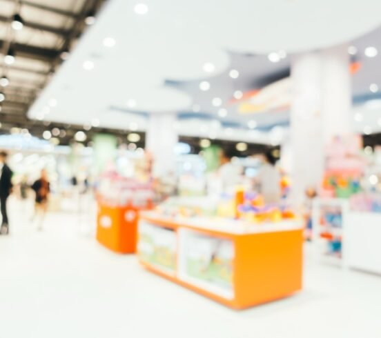 Abstract blur and bokeh defocused shopping mall interior of department store for background